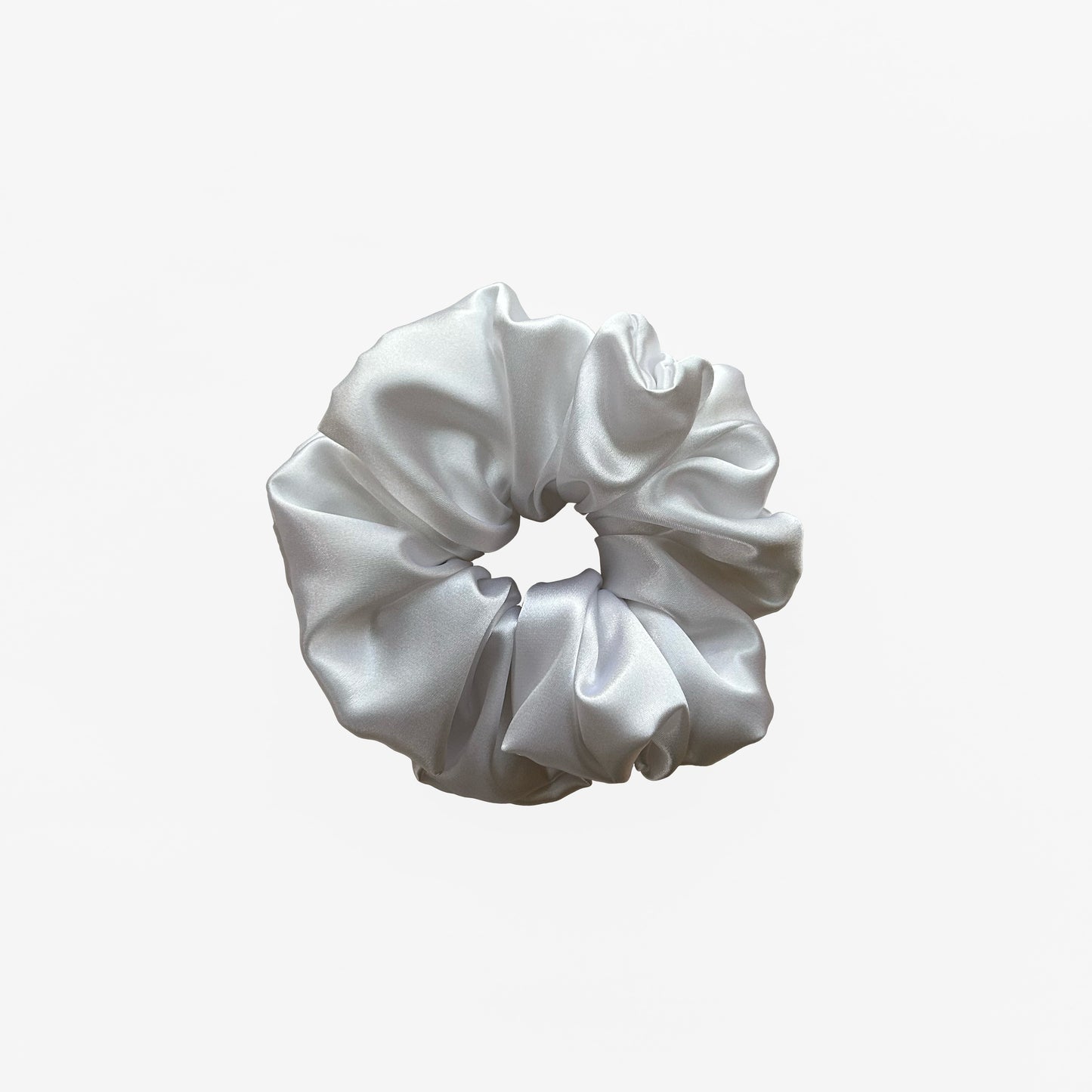 White satin scrunchie from Nude collection in large size, displayed on a white background.
