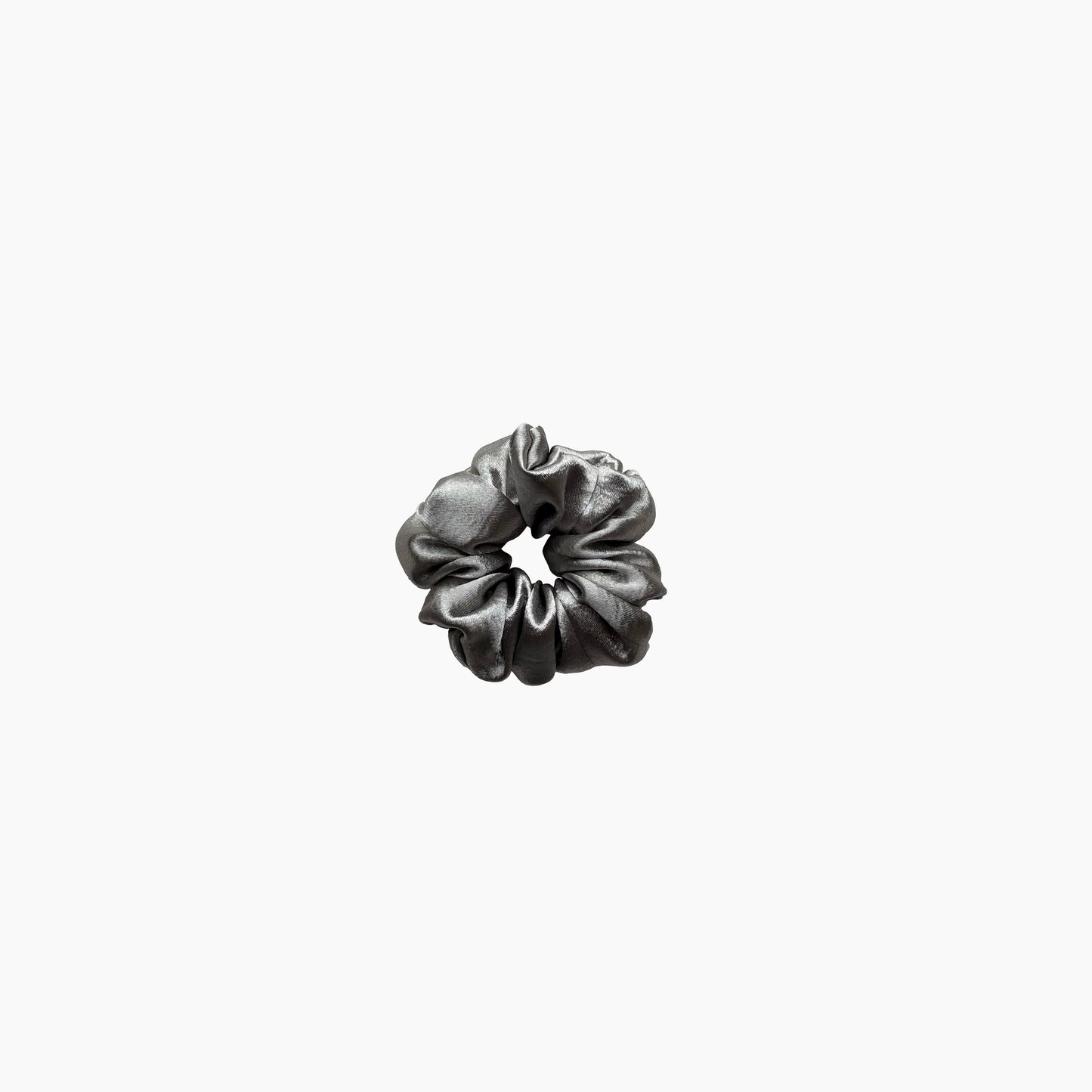 Silver satin scrunchie from Pebble Satin collection in medium size, displayed on a white background.
