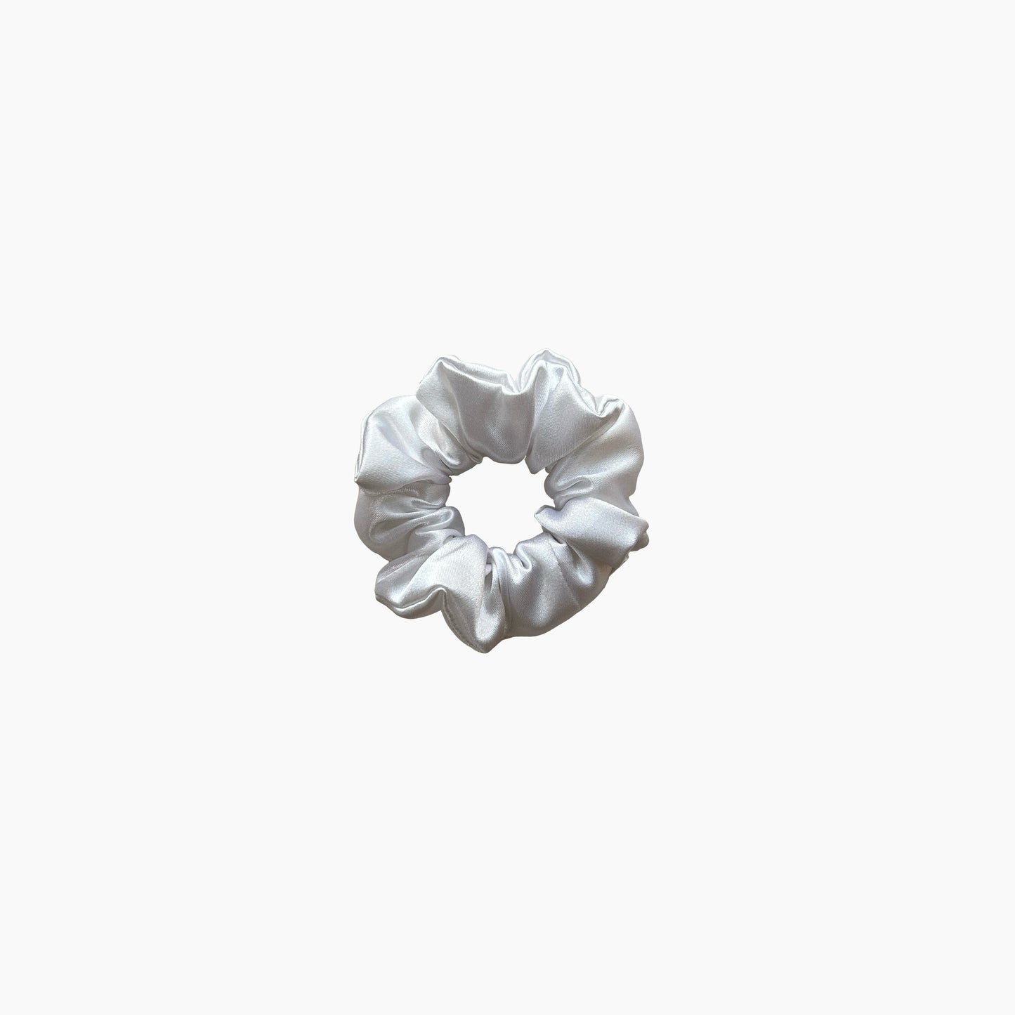White satin scrunchie from Nude collection in small size, displayed on a white background.