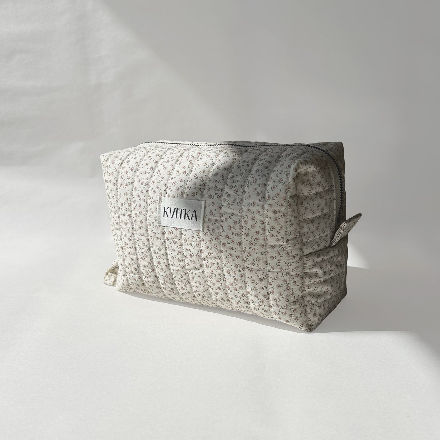 Medium-size of quilted makeup bag from the Ditsy Blossom collection, angled to the right view on a soft white background.