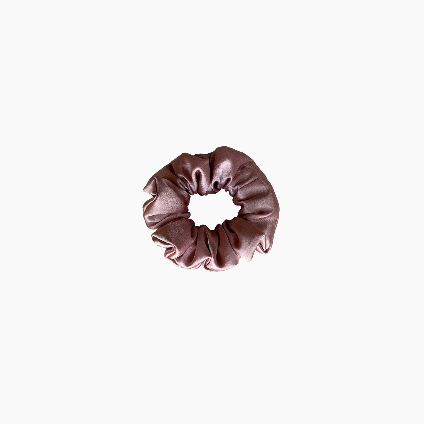 Pink satin scrunchie from Nude collection  in small size, displayed on a white background.